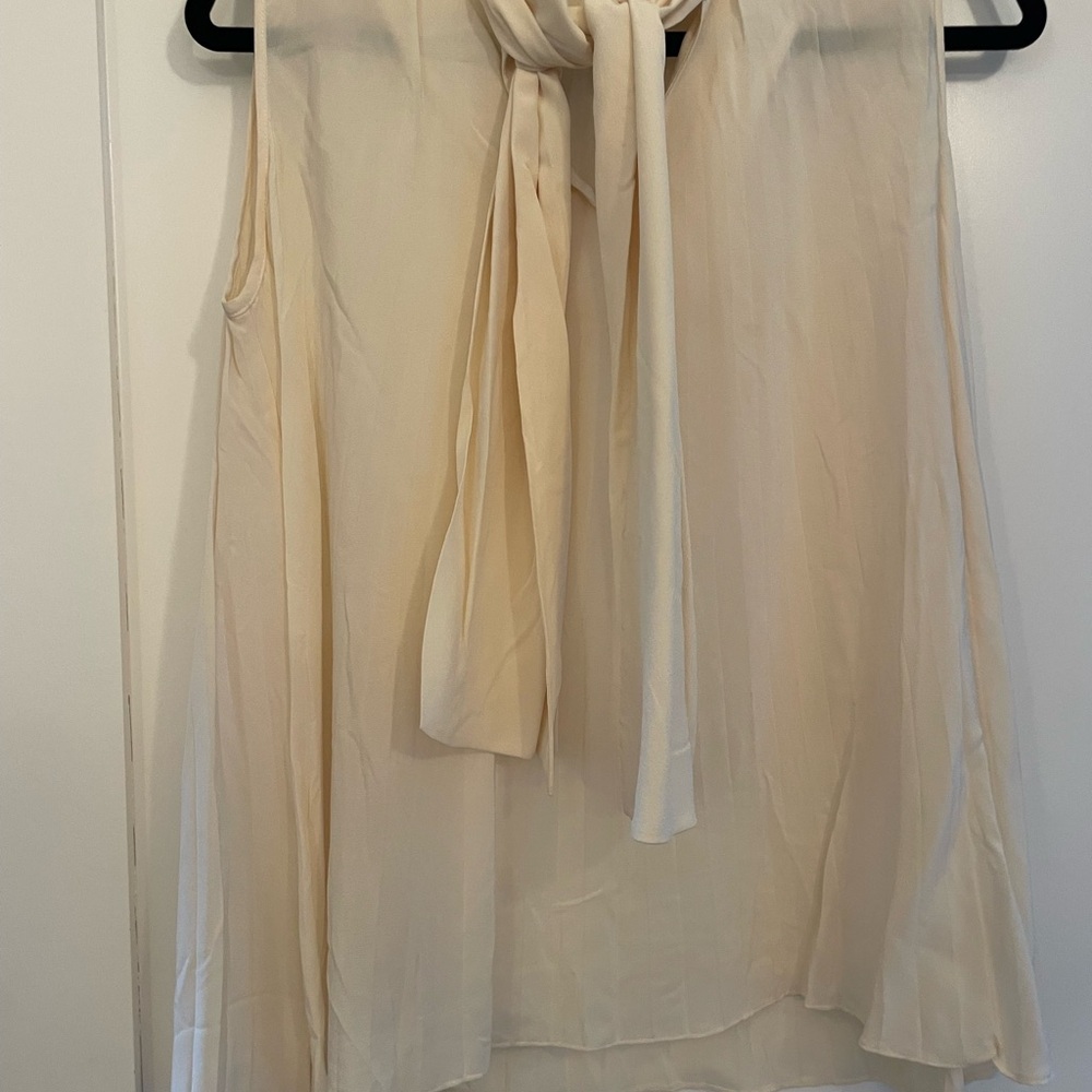 Elegant Cream Sleeveless Blouse with Bow Tie
